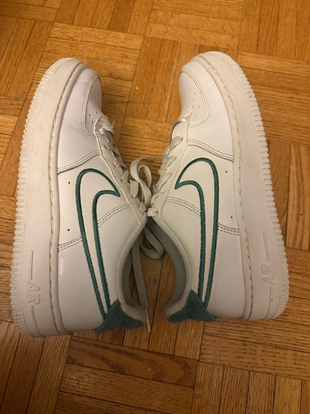 Nike Women’s White Leather Sneakers with Teal Swoosh
